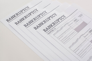 Obraz premium bankruptcy papers on white background with copy space
