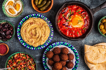 Falafel, hummus, shakshuka, Israeli salad - traditional dishes of Israeli cuisine.