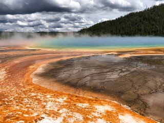 Mellow fog over a volcanic lake at yellowstone national park
