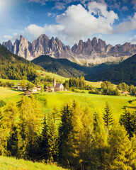 Countryside view of the Funes valley St. Magdalena or Santa Maddalena in the National park Puez Odle or Geisler. Dolomites, South Tyrol. Location Bolzano, Italy, Europe. Dramatic scene. Beauty world.