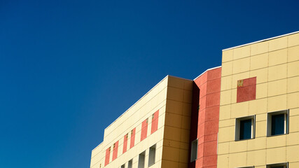 red and white building on the sky