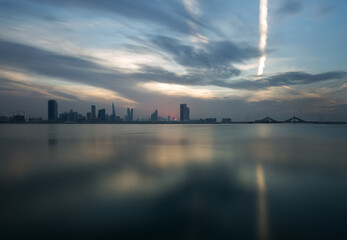 Bahrain skyline at sunset with dramatic clouds