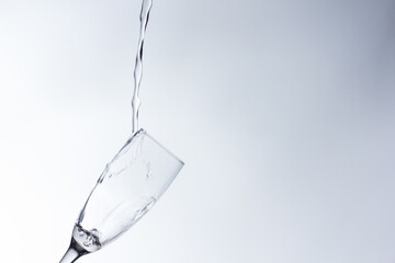 water falling into a clear glass