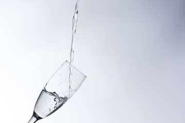 water falling into a clear glass
