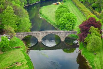 Fototapeta na wymiar Bouillon, Belgium. High angle view of arch stone bridge Pont de Cordemoy over Semois river