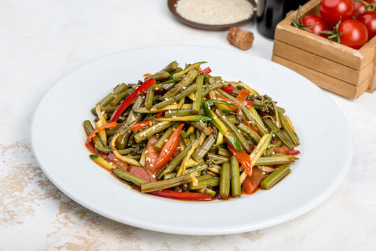 Salad of fern, vegetables sprinkled with sesame seeds