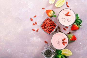 Healthy blended drink. Organic vegan non dairy smoothie with strawberry and goji berries, chia...