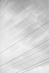 Urban architecture, city landscape, background and texture. Geometry in the sky. Power lines on the background of the sky texture