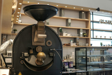 Vintage coffee roasting machine in a coffee shop