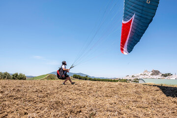 Man trying to take off the paraglider