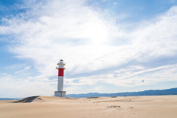 DELTA DE L'EBRE, TARRAGONA, CATALUNYA, SPAIN - JUNE 5, 2019: Beach of "punta del fangar" lighthouse "far del fangar".