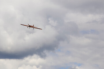 Fototapeta na wymiar Flight of a radio-controlled airplane in the sky.