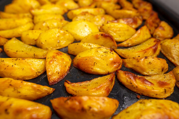 Baked potatoes in the oven as a background.