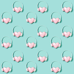 Seamless pattern with volumetric paper pink heart in white headphones. Concept for music festivals,...