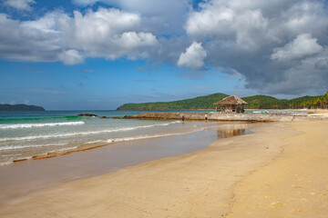 Beautiful beach in the Philippines with blue sky and clouds