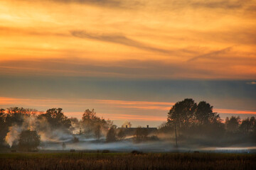 Panorama of hay stack valley at the sunset time, agriculture scene