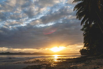 Fototapeta na wymiar Beautiful cloudy beach with sunset in the Philippines