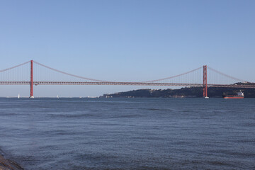 Fototapeta na wymiar view of the cable-stayed 25th of April bridge over the Tagus in Lisbon