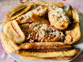 Close-up of fried cheese banana on a white plate. Food photography