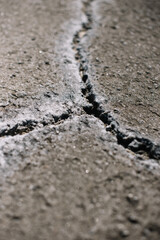 Crack in the pavement filled with sea salt, close up view