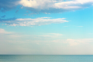 Fototapeta na wymiar calm sea scenery with low clouds