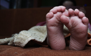 baby feet in bed