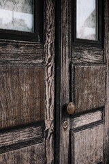 Beautiful old rustic wooden door, vertical photo 