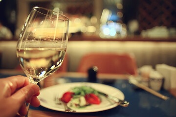 glass white wine restaurant interior, abstract evening dinner with alcohol at the bar