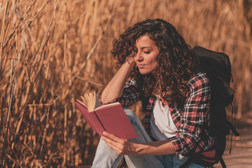 Woman reading a book outdoor