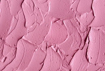 Pale pink cosmetic clay (alginate facial mask, face cream, body wrap) texture close up, selective...