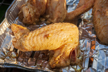 Close-up chicken wings on grill. Grilled meal food. Roasted chicken.