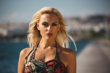 A woman standing next to a body of water