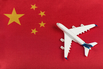 Flag of China and model airplane. Resumption of flights after quarantine, opening borders