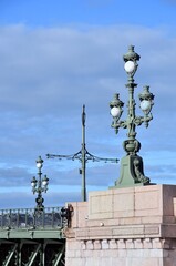 Fototapeta na wymiar Old street lamp on Troitsky bridge in Saint-Petersburg, Russia 