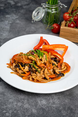 Meat with vegetables in sauce and fresh herbs