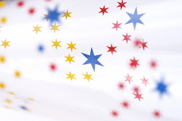 Close-up of colorful stars on the champagne glass