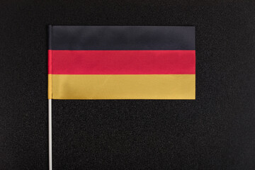 National flag of Germany on black background. National symbols of Germany