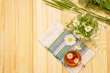 Chamomile tea. Fresh flowers, summer hot drink concept. Alternative medicine, lifestyle