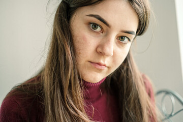 Close up of girl working on tablet from home during period of restrictions.