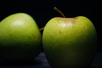 green apples on black background