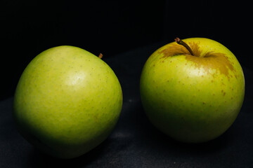 apples on black background