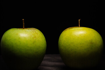 green apples on black background