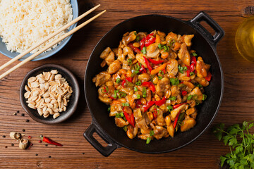Chicken kung pao. Fried chicken pieces with peanuts and peppers.