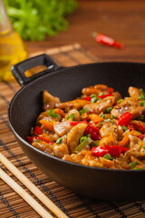 Chicken kung pao. Fried chicken pieces with peanuts and peppers.