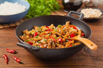 Chicken kung pao. Fried chicken pieces with peanuts and peppers.