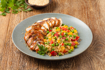 Grilled chicken breast in teriyaki sauce. Served with brown rice and vegetables.