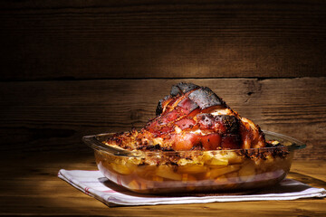 Roast pork knuckle served with boiled cabbage, bread, horseradish and mustard