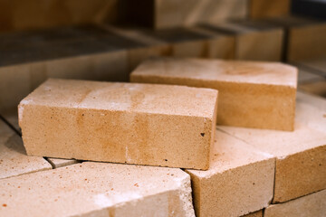 brick construction, solid brick. Material for construction and repair. Clay light brick, brick texture, preparation for the construction process