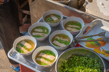 Banh Cuon in Vietnamese language steamed rice rolls on pot favorite delicious traditional food of Vietnam