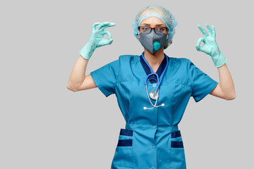 female doctor with stethoscope wearing protective mask and latex gloves over light grey background